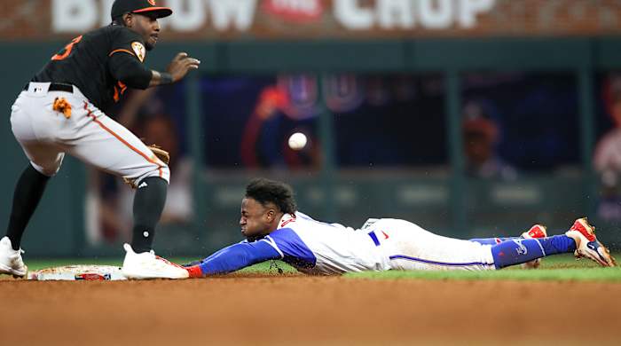 Braves second baseman Ozzie Albies slides headfirst into second base